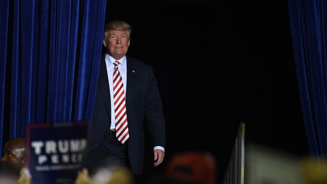 Donald Trump takes the stage at a campaign rally at the Prescott Valley Event Center on Oct. 4, 2016, in Prescott Valley, Ariz.