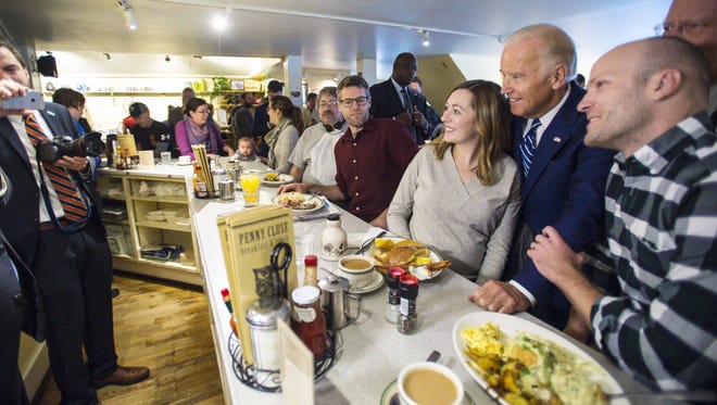 Vice -President Joe Biden poses for a photo as he greets diners at the Penny Cluse Cafe in Burlington before participating in a Cancer Moonshot Roundtable at the University of Vermont on Friday, October 21, 2016.