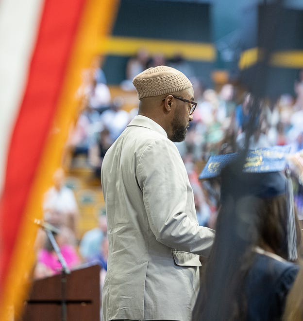 Burlington High School's social studies teacher Korey Whitfield speaks to students during graduation ceremonies for Burlington High School on Thursday, June 13, 2024, at University of Vermont Patrick Gymnasium in Burlington.