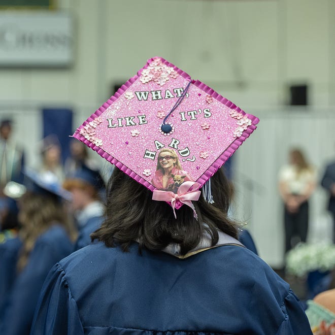 Student walks to their seat at the start of graduation ceremonies for Burlington High School on Thursday, June 13, 2024, at University of Vermont Patrick Gymnasium in Burlington.