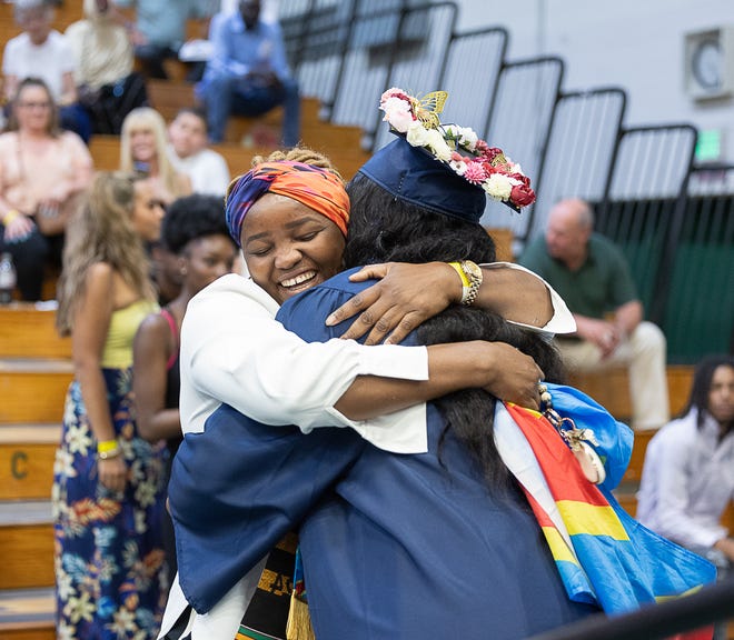 Garcia Monkapama hugs her mother after getting her diploma during graduation ceremonies for Burlington High School on Thursday, June 13, 2024, at University of Vermont Patrick Gymnasium in Burlington.