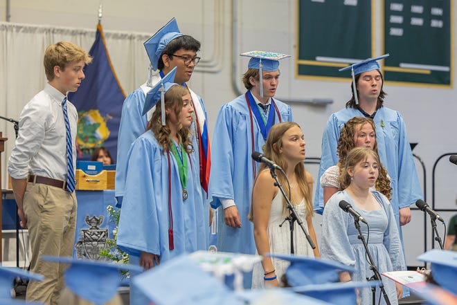 The choral selection sings "Bring Me All Your Dreams" during graduation ceremonies for South Burlington High School on Friday, June 14, 2024, at University of Vermont's Patrick Gymnasium in Burlington.