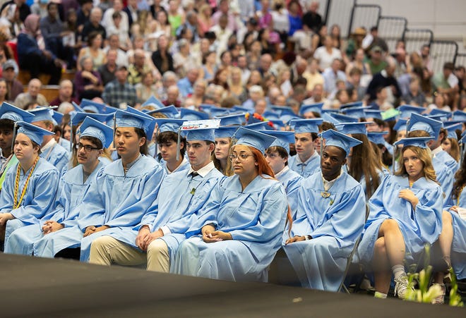 Students listen to the speakers during graduation ceremonies for South Burlington High School on Friday, June 14, 2024, at University of Vermont's Patrick Gymnasium in Burlington.