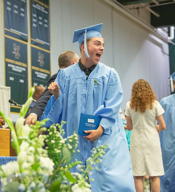 A student celebrates after getting a diploma during graduation ceremonies for South Burlington High School on Friday, June 14, 2024, at University of Vermont's Patrick Gymnasium in Burlington.