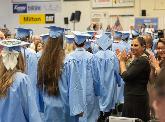 Friends and family clap as the graduates walk in during graduation ceremonies for South Burlington High School on Friday, June 14, 2024, at University of Vermont's Patrick Gymnasium in Burlington.