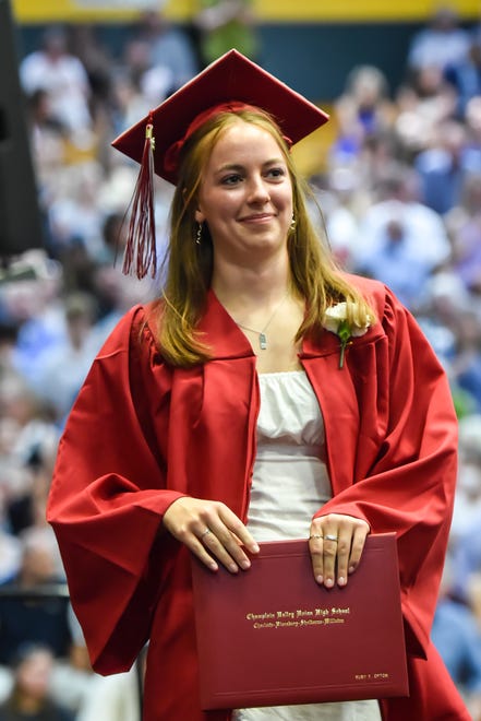 Ruby Opton, a graduate of the class of 2024, receives her diploma at the 60th Commencement Exercise of the Champlain Valley Union High School on Friday, June 14, 2024, at UVM's Patrick Gym in Burlington.