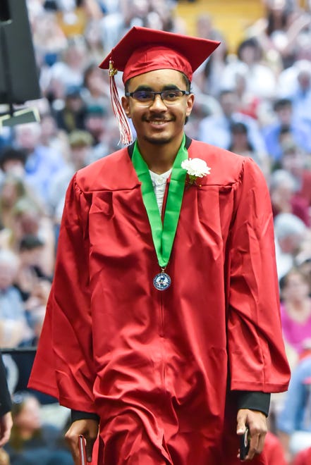 Mohamed Mohamed Elhassan, a graduate of the class of 2024, receives his diploma at the 60th Commencement Exercise of the Champlain Valley Union High School on Friday, June 14, 2024, at UVM's Patrick Gym in Burlington.