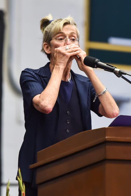 Class speaker, Robin Fawcett, ends her comments with a harmonica solo at the 60th Commencement Exercise of the Champlain Valley Union High School on Friday, June 14, 2024, at UVM's Patrick Gym in Burlington.