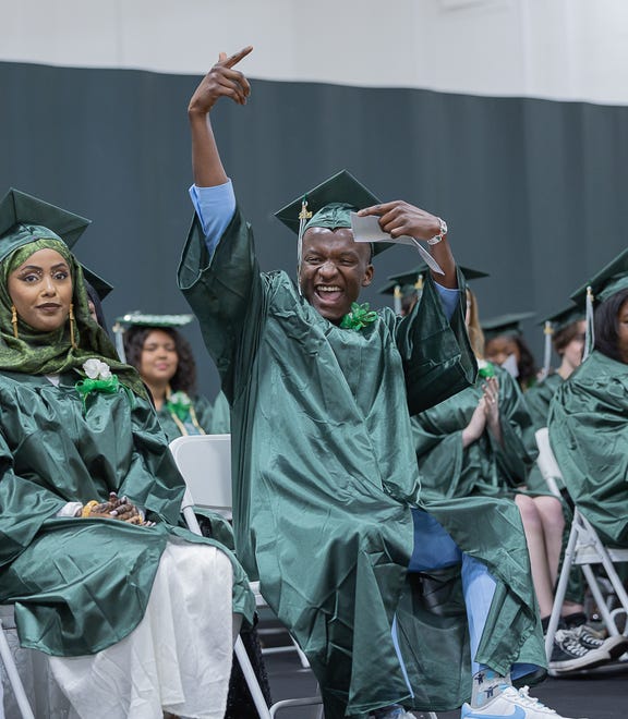 Student rejoices after receiving his scholarship during graduation ceremonies for Winooski High School on Saturday, June 15, 2024, at Winooski High School in Winooski.