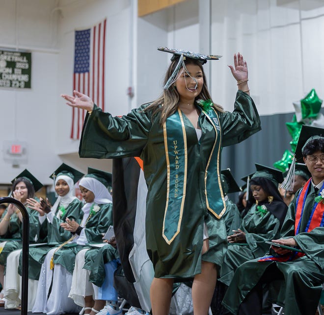 Student waves goodbye to her fellow graduates during graduation ceremonies for Winooski High School on Saturday, June 15, 2024, at Winooski High School in Winooski.