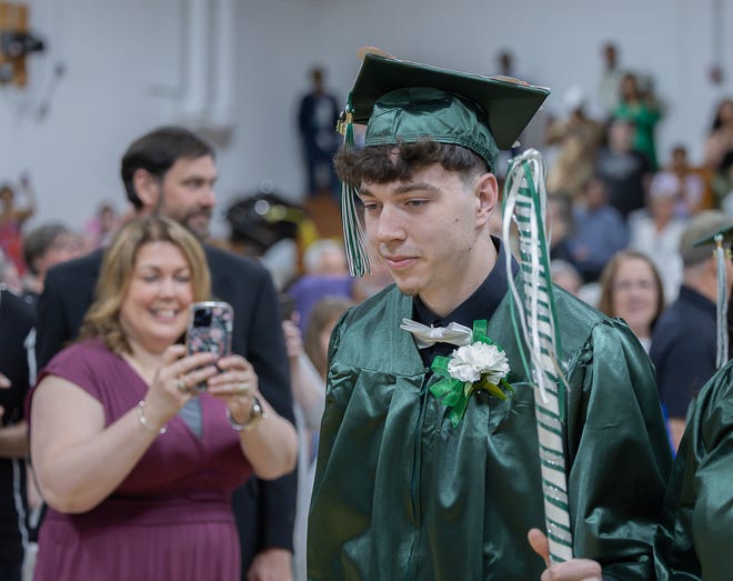 Samuel Parris leads the graduates at the start of graduation ceremonies for Winooski High School on Saturday, June 15, 2024, at Winooski High School in Winooski.