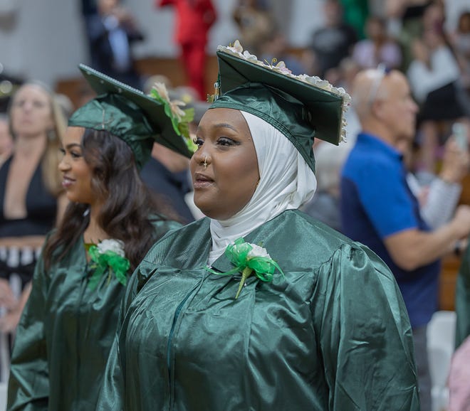 A graduate enters the room during graduation ceremonies for Winooski High School on Saturday, June 15, 2024, at Winooski High School in Winooski.