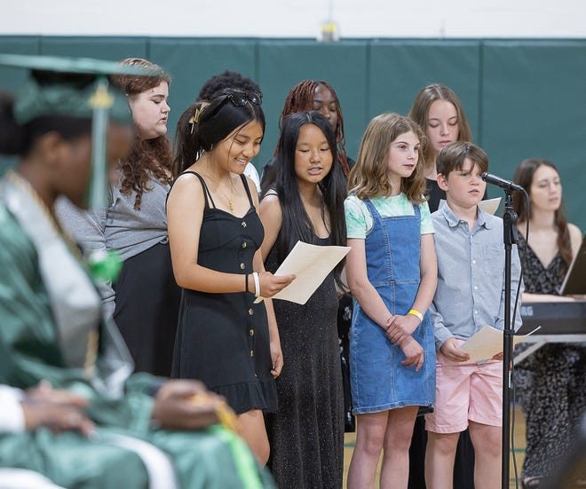 Younger Winooski students sing "Moments Like This" during graduation ceremonies for Winooski High School on Saturday, June 15, 2024, at Winooski High School in Winooski.