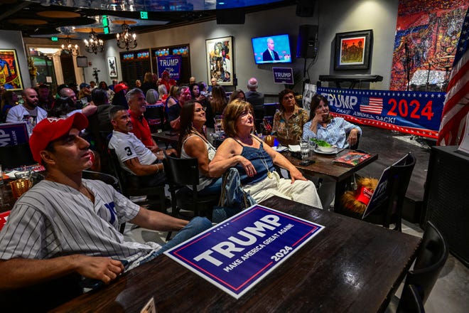 Supporters of Donald Trump attend a watch party for the first presidential debate of the 2024 presidential elections between President Joe Biden and former President and Republican presidential candidate Donald Trump in Miami, on June 27, 2024.