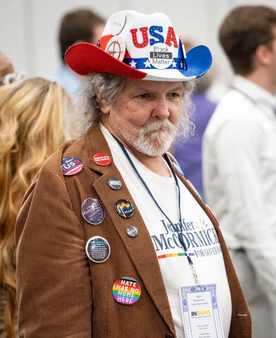 Mark Smith, a delegate, wears buttons showing support for issues he believes in Saturday, July 13, 2024, during the Indiana Democratic State Convention in Indianapolis.