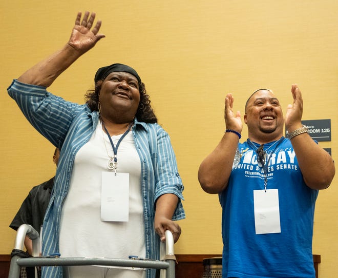 Dawn Lewis, left, and Demetrice Hicks cheer for candidates as they speak to the Indiana Democrat African American Caucus on Saturday, July 13, 2024, during the Indiana Democratic State Convention in Indianapolis.