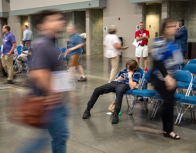 Sirius Council, 13, waits while his father networks with delegates from across the state Saturday, July 13, 2024, during the Indiana Democratic State Convention in Indianapolis.