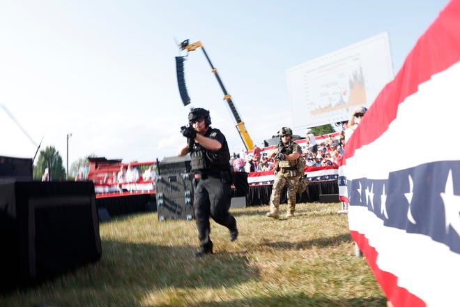 Law enforcement officers move during a rally on July 13, 2024, in Butler, Pennsylvania.