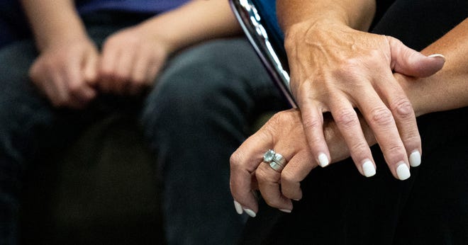 Jennifer McCormick, Democrat nominee for governor, holds her wrist as the delegates votes are read for attorney general on Saturday, July 13, 2024, during the Indiana Democratic State Convention in Indianapolis.