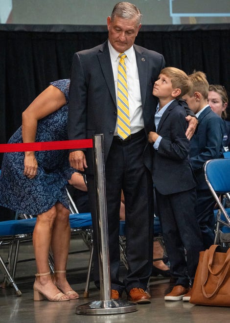 Berley Goodin, 11, hugs his dad, Terry Goodin, after he received the Democratic nomination for lieutenant governor on Saturday, July 13, 2024, during the Indiana Democratic State Convention in Indianapolis.