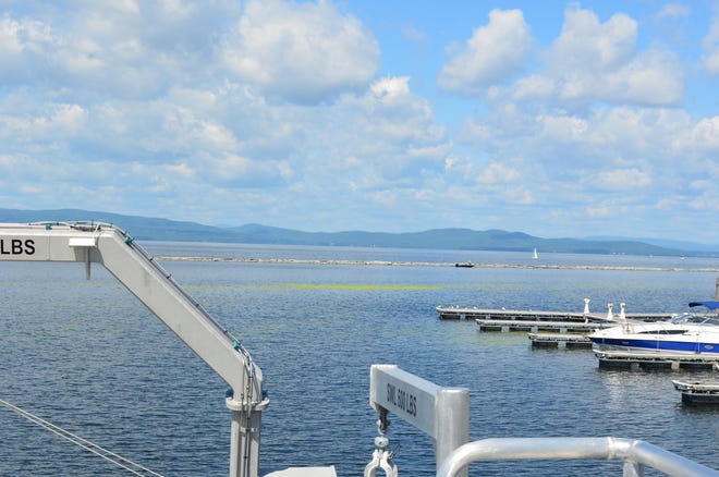 Pollen sits on the water by the Burlington waterfront July 18, 2024. The view is from the UVM research vessel Marcelle Melosira.