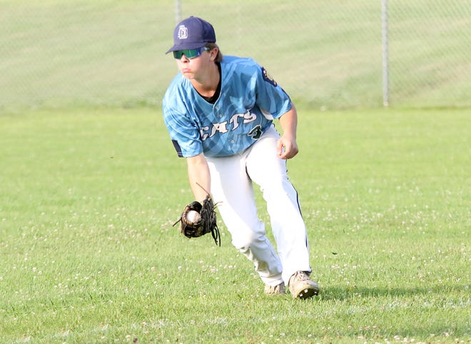 Cedric LaMothe scoops up a ground ball in right field during the South Burlington Wildcats 3-2 win over St Johnsbury Post 58 on Tuesday night at Veterans Memorial Park in South Burlington.