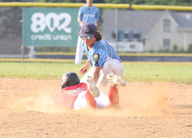 Mason Sweetser tages out Logan Wheeler during the South Burlington Wildcats 3-2 win over St Johnsbury Post 58 on Tuesday night at Veterans Memorial Park in South Burlington.