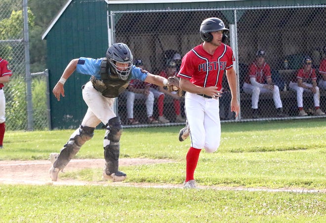 Catcher Kyle Tanis tags out Will Emerson on a dropped 3rd strike during the South Burlington Wildcats 3-2 win over St Johnsbury Post 58 on Tuesday night at Veterans Memorial Park in South Burlington.