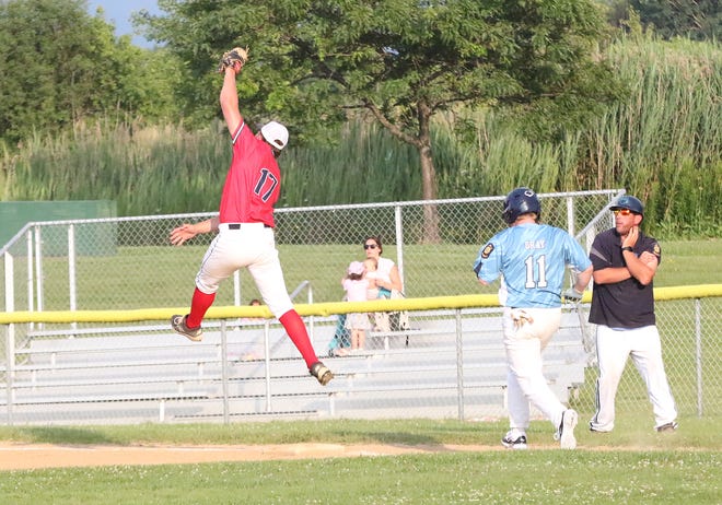 First baseman Brody Kingsbury makes a leaping catch on a throw to 1st during St Johnsbury Post 58's 3-2 loss to the South Burlington Wildcats on Tuesday night at Veterans Memorial Park in South Burlington.