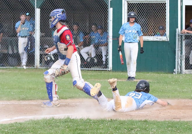 Quinn Kaiden slides home with the game tying run during the South Burlington Wildcats 3-2 win over St Johnsbury Post 58 on Tuesday night at Veterans Memorial Park in South Burlington.