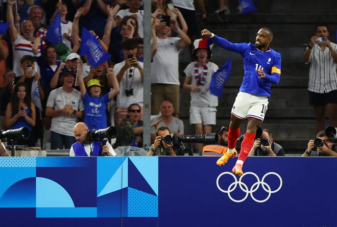 Alexandre Lacazette of France celebrates scoring their first goal against the USA during a men's Group A football match during the Paris 2024 Olympic Summer Games at Orange Velodrome on July 24, 2024, in Marseille, France.