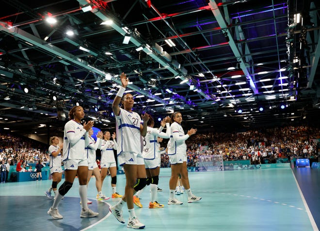 France players salute their fans after playing against Hungary in a women's handball group B match during the Paris 2024 Olympic Summer Games at South Paris Arena 6.