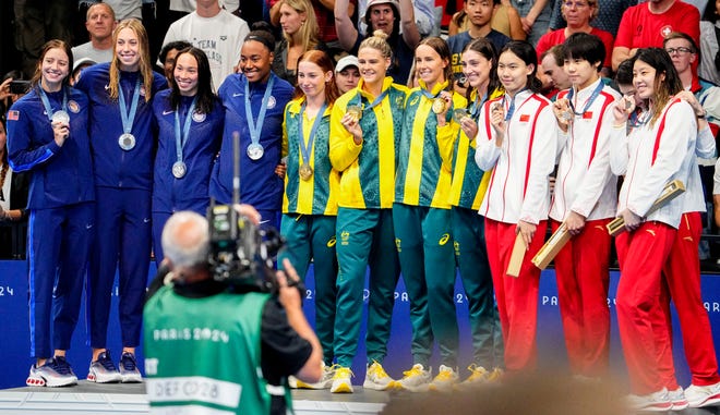 USA, Australia and China in the women’s 4 x 100-meter freestyle relay medal ceremony during the Paris 2024 Olympic Summer Games at Paris La Défense Arena.