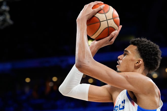 France power forward Victor Wembanyama (32) shoots against Brazil in the second half during the Paris 2024 Olympic Summer Games at Stade Pierre-Mauroy.