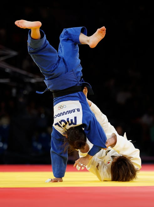 Natsumi Tsunoda (JPN) defeats Baasankhuu Bavuudorj (MGR) in the women's judo 48kg gold medal match during the Paris 2024 Olympic Summer Games at Champ-de-Mars Arena.