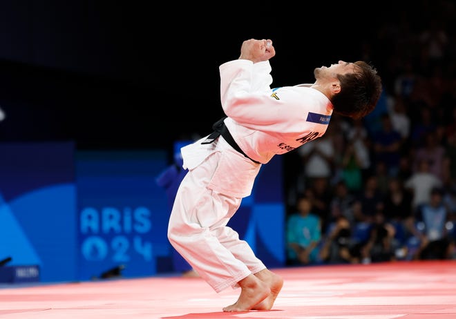 Yeldos Smetov (KAZ) defeats Luka Mkheidze (FRA) in the men's 60kg gold medal match during the Paris 2024 Olympic Summer Games at Champ-de-Mars Arena.