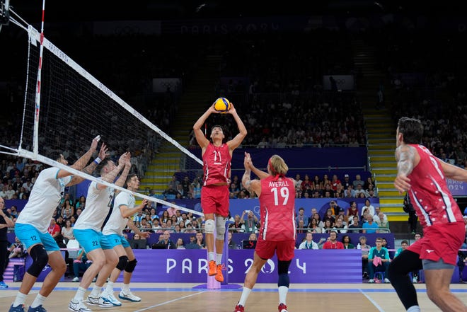 United States of America setter Micah Christenson (11) sets against Argentina during the Paris 2024 Olympic Summer Games at South Paris Arena 1.