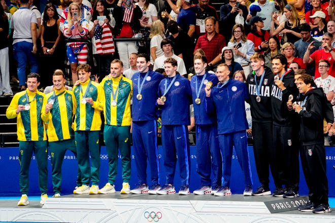 Australia, USA and Italy in the men’s 4 x 100-meter freestyle relay medal ceremony during the Paris 2024 Olympic Summer Games at Paris La Défense Arena.