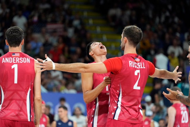 United States of America setter Micah Christenson (11) and outside hitter Aaron Russell (2) react before the match against Argentina during the Paris 2024 Olympic Summer Games at South Paris Arena 1.