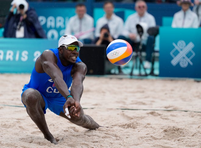 Jorge Luis Alayo Moliner (CUB) in a beach volleyball preliminary phase match against USA during the Paris 2024 Olympic Summer Games at Eiffel Tower Stadium.