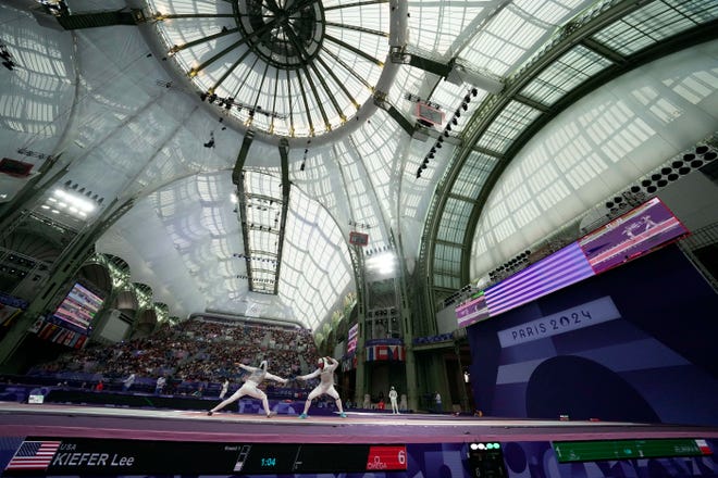 Lee Kiefer (USA) competes against Martyna Jelinska (POL) in a women's foil individual table of 32 match during the Paris 2024 Olympic Summer Games at Grand Palais.