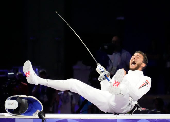 Mohamed Elsayed (EGY) celebrates after defeating Tibor Andrasfi (HUN) in a men's epee bronze medal bout during the Paris 2024 Olympic Summer Games at Grand Palais.